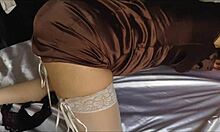 French woman in satin dress and lingerie enjoys doggy style and oral sex