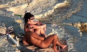 brunette strips blue panties, flaunts chubby body on beach