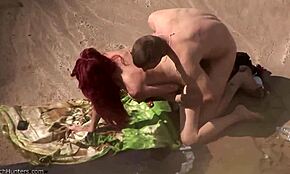 I watched this redheaded nudist spread legs for deeper public beach fucking