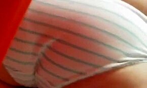 tanned blonde caught looking steamy in a hidden dressing room cam.