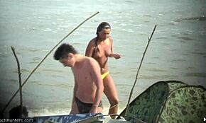 OMG, caught this topless bombshell flaunting perky titties on a nudist beach!