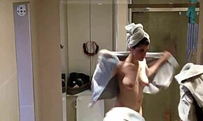 showering brunette showcases her beautiful pale breasts on cam