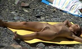 perverted guy pickin on hot girls while they relaxin at beach. dang, they so flexible outdoors!
