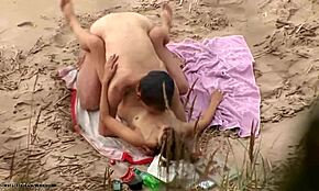 man, drilling this dark-haired girlfriend doggy style on the beach is wild!