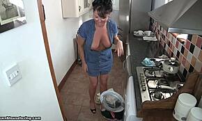 hey, this milf with a killer tan is flashing her gorgeous breasts in the kitchen today