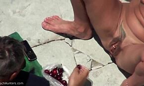 shades-wearing blonde masturbates for joy on hidden beach cam