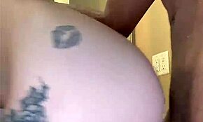 Tatted white girl fucks black cock