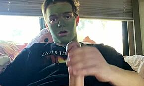 Fit guy strokes his cock during skin care routine