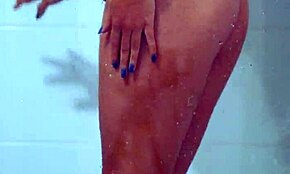 gorgeous tanned college girl showers in sexy bikini