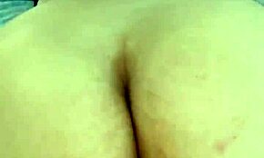 mature woman relaxing while husband works