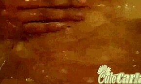 Is cute Carla fingering her pussy in the bathtub?