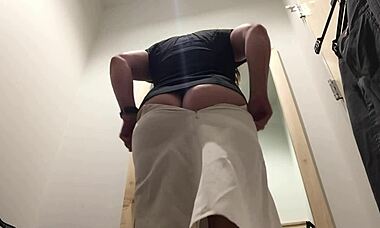 Candid Camera Captures Brunette Housewife Flashing in Mall Changing Room