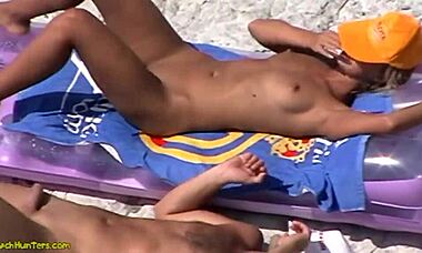 Nudist Blonde Sunbathing Naked on Hidden Beach Cam