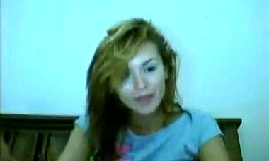 Curious Gal Explores Shaved Pussy on Webcam Bed