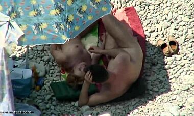 Sideways banging with a blond nudist on the beach