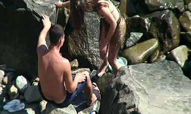 hidden cam catches horny nudist beauty in quick beach cowgirl action