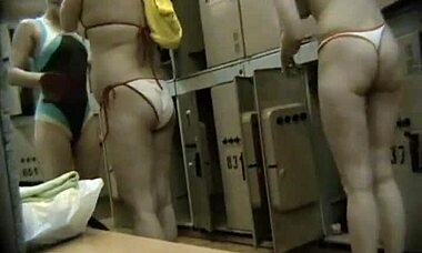 Happy voyeur spies naughty blonde with curly hair in changing room through hidden cam.