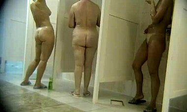 Hot tanned babe showering with fat sluts, trimmed pussy visible in hidden cam