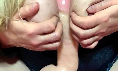 Yo, watch my slut wife suck and tit fuck this big dildo like a pro