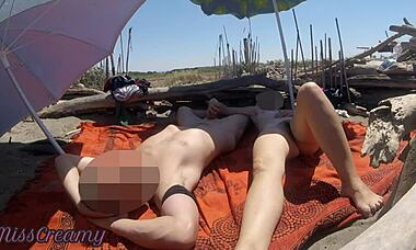 Flashing my cock to strangers on public beach, will she help me cum? MissCreamy joins the risky fun.